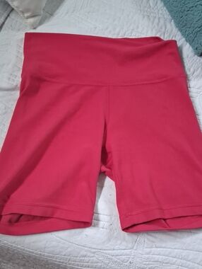 TNA High-Rise Bike Shorts in Bright Pink